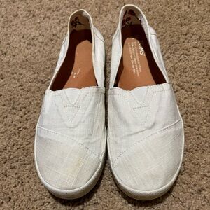 Tom’s White Slip Ons, size 7W.